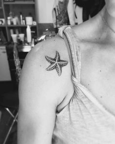 a woman with a starfish tattoo on her shoulder