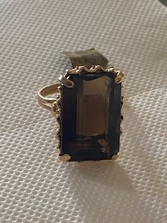 This magnificent Smoky Quartz Ring set in 18ct Yellow Gold is simply stunning Stone measures 22mm x 12mm Gorgeous decorative cage for this beautiful stone  Ring size "O" Smoky Quartz Ring, Quartz Ring, Smoky Quartz, Stone Rings, Rings Statement, Ring Sets, Statement Rings, Favorite Jewelry, Ring Size