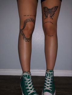 the legs and ankles of a person with tattoos on them