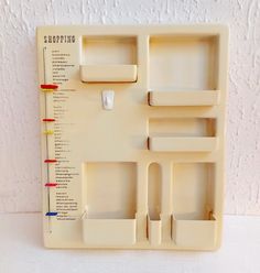 a white plastic tray with compartments for different items on the side and numbers in each section