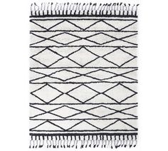 a black and white rug with fringes on it