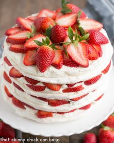 a white cake with strawberries on top