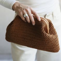 Atelier Maier bags are hand-crocheted with sustainable waxed cotton yarns finished with genuine leather details. A simplistic piece with a leather touch, that embraces minimal aesthetics, handmade from start to finish.  This crochet clutch effortlessly transitions from everyday use to special occasions, it will be your companion from day to night. And also perfect for birthday gift, anniversary gift that lasts.  * Hand-crocheted with Care * Waxed Cotton Yarn  * Leather trimmed Magnetic Frame * 3 Creative Pragmatist, Straw Pouch, Raffia Crochet, Magnetic Frame, Gray Handbags, Cloud Bag, Tan Handbags, Tan Bag, Crochet Clutch