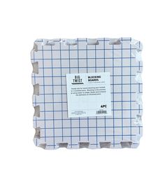 the back side of a white and blue plaid paper with a sticker on it