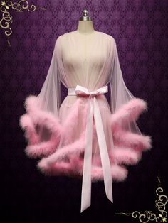 This marabou fur edged boudoir robe is incredibly sexy and playful, perfect for your honeymoon! Photoed in a pink shade, can be made in other colors of your choice. Long： Approx 57-59 inches long Short : Approx 35 inches Long Working Time: 1-2 weeks Rush Order or customization please inquire prior to order. Custom Designs We specialize in custom design services.If there's a dress you like and it's not on our website,you're more than welcome to email us a picture of the dress for a quote. Fluffy Short Hair, Honeymoon Robe, Fancy Robes, Short Hair Fringe, Fur Outfit, Bridal Honeymoon, Fur Dress, Wedding Robe, Pink Fur