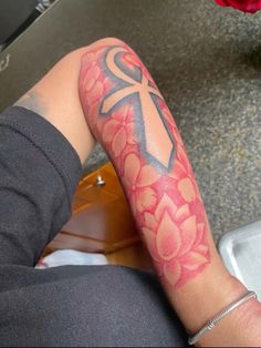 a person with a tattoo on their arm