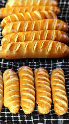 several different types of breads lined up on a rack