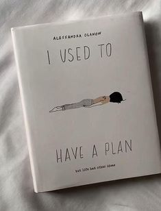 the book i used to have a plan is laying on a bed