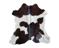 a cowhide rug with brown and white spots