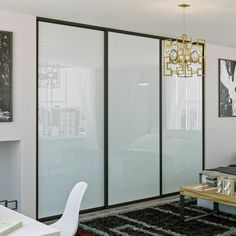 a living room with sliding glass doors and furniture