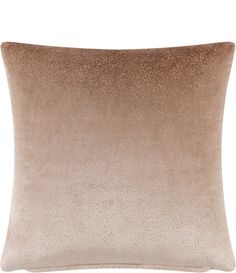 a beige pillow with a brown ombretta on the front and side of it