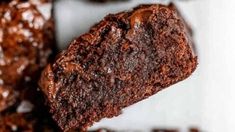 a close up of some brownies on a plate