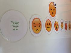 there are many stickers on the wall with different emoticions and words in them