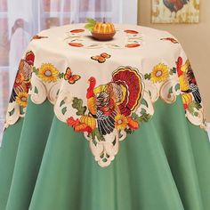 a table with a turkey and sunflower design on it