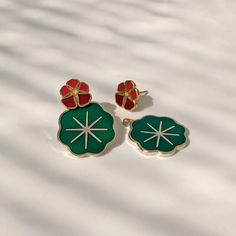 "Nasturtiums, who colored you, you wonderful, glowing things? You must have been fashioned out of summer sunsets." —Lucy Maud Montgomery enamel flower studs with leaf ear jackets0.4 inch stud, 1 inch with jacket24k gold plate flowers, silver plated leavesnickel-free post & butterfly claspsold as pair Red Flower-shaped Earrings For Spring, Red Flower Shaped Earrings For Spring, Lucy Maud Montgomery, Plate Flowers, Jacket Earrings, Earring Jackets, Flower Plates, Summer Sunset, Free Post