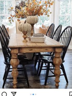 an instagramted photo of a dining room table with chairs and vases on it