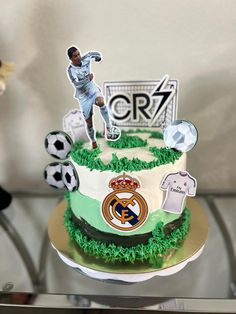 there is a cake that has soccer decorations on it