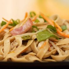 a plate with noodles and vegetables on it