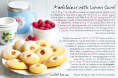 a plate with raspberries and lemon cookies on it next to some other items