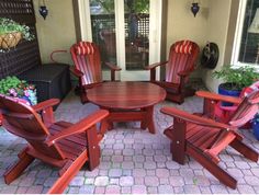 a wooden table and chairs on a patio