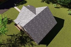 an aerial view of a house in the middle of a grassy area with trees and bushes