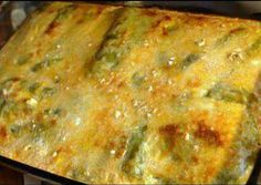 an enchilada casserole in a pan on the stove