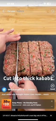 someone cutting up some food on top of a wooden table next to an iphone app