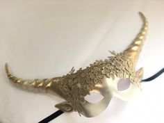 Whimsical dreamland collection Gold goddess horned masquerade mask C U S T O M I Z A T I O N Can be customized further. Get in touch for custom orders! S I Z E Adult size. S H I P P I N G - Processed same day or within 24 hours. 1-2 day guaranteed delivery, add item to cart, click shipping tab for rates. Pls leave a check out note with your need date & contact number Msg for delivery time frames (Include your state/country) C O N T A C T Text: 1-516-654-4643 Email: Lanai.ink6 [!at] gmail.com Gold Fantasy Festival Masks And Prosthetics, Fantasy Gold Masks And Prosthetics For Halloween, Fantasy Masquerade Mask For Carnival Festival, Fantasy Style Masquerade Mask For Carnival Festival, Fantasy Masks For Carnival, Gold Fantasy Mask For Costume Party, Fantasy Masks And Prosthetics For Mardi Gras, Gold Fantasy Masquerade Mask For Costume, Fantasy Horned Masquerade Mask For Costume