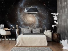 a bedroom with a large wall mural in the middle