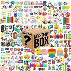 a cardboard box filled with lots of different toys and magnets on top of it