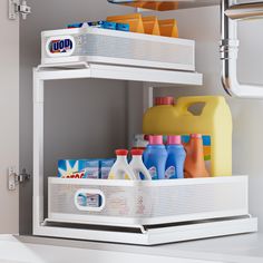 a white shelf filled with lots of cleaning products