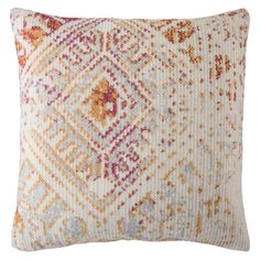 an orange and pink pillow with a diamond pattern on the front, sitting on a white background