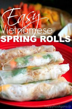 an easy vietnamese spring rolls recipe on a red plate with the words easy vietnamese spring rolls