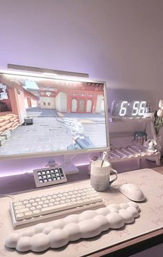 a desk with a computer, keyboard and mouse on it in front of a clock