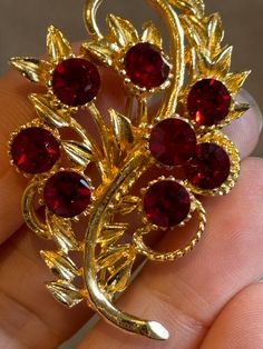 Vintage gold tone brooch set with faceted rich red stones having a roll over clasp Red Brooch Jewelry For Formal Occasions, Red Brooch For Jewelry Making, Red Costume Jewelry Brooch, Red Formal Costume Jewelry Brooches, Red Crystals, Red Stone, Vintage Gold, Stones And Crystals, Brooch Pin