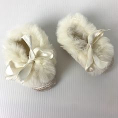 "Vintage 50s/60s white quilted baby shoes or booties with rabbit fur trim.  Also includes original box. 3.5\" from toe to heel 1.75\" at widest point Material: fabric, rabbit fur Brand/Maker: Mrs. Day's Ideal Baby Shoe Company Inc. Condition:  - Very good vintage condition - There is light general wear typical of age and usage - Very light soiling on the sole. See photos." White Booties As Winter Gift, White Winter Booties As A Gift, White Winter Booties As Gift, Felt Patch, Shoe Company, Rabbit Fur, Crib Shoes, White Quilt, Shoes Booties