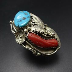 "VINTAGE NAVAJO RING DESCRIPTION: This spectacular ring features Sleeping Beauty turquoise and old red Mediterranean branch coral. The gemstones are secure in scalloped bezel, on a foundation of heavy gauge vintage sterling silver. Highly detailed applied leaves enhance the face of the ring. This impressive ring will be a treasured addition to your collection of fine vintage Native American jewelry. MEASUREMENTS: Ring face measures 2\" x 1 1/4\" Turquoise cabochon measures 20mm x 13mm RING SIZE: Red Inlay Ring Jewelry, Red Inlay Ring, Red Ring With Inlay, Red Vintage Jewelry With Cabochon, Vintage Multi-stone Collectible Rings, Vintage Inlay Rings For Anniversary, Red Southwestern Style Collectible Jewelry, Southwestern Style Red Ring Jewelry, Vintage Turquoise Ring With Inlay For Anniversary