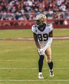 a football player standing on top of a field