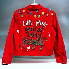 a red jacket with lights on it that says, little miss good day being magnificent