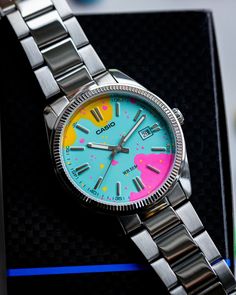 Casio MTP 1302 Hand painted dial in a beautiful Candy like style, Stainless steel bezel and stainless steel bracelet clasp. The watch is brand new and modified in house by me. I only use high quality paint, that has a high UV resistance so that the colors will stay bright and vibrant for a long time. Get your watch resized so it fits when you receive it. Measure your wrist around the spot where you place your watch and select the size option that fits the best. The watch bracelet has a micro adj Multicolor Analog Watches For Gift, Multicolor Analog Watches As Gift, Gift Multicolor Analog Watches, Multicolor Analog Display Watch Accessories With Round Dial, Trendy Multicolor Watches As Gifts, Trendy Multicolor Quartz Watches, Modern Multicolor Watches With Metal Dial, Turquoise Quartz Watch For Gifts, Unique Wrist Watch