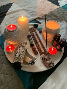 a tray that has candles and other items on it