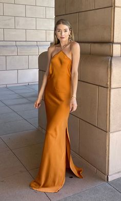 This beautiful maxi dress presents a sophisticated look, boasting burnt orange fabric and a fashionable gold chain closure at the neck. Masterfully constructed from premium materials, it is sure to be an enduring addition to any luxury wardrobe. Please be aware that this dress is a slip on style with no closure except at the neckline. 100% Polyester Burnt Orange Slip Dress, Silk Burnt Orange Bridesmaid Dresses, Orange Satin Bridesmaid Dresses, Burnt Orange Silk Dress, Silk Orange Dress, Burnt Orange Prom Dress, Burnt Orange Fabric, Orange Silk Dress, Mexico Dress