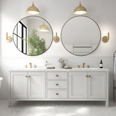 a bathroom with two round mirrors on the wall