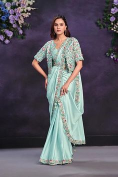 Saree Fabric : Crepe Satin Silk Blouse Fabric: Malai Satin Color : Aqua Blue Work: Cord, Sequence & Thread with Stone & Moti Work Product contains : 1 Saree, 1 Blouse Wash Care: Dry Clean Only Anarkali Pre-draped Saree With Floral Embroidery For Navratri, Anarkali Style Pre-draped Floor-length Saree With Floral Embroidery, Navratri Pre-draped Saree With Floral Embroidery, Blue Embroidered Pre-draped Saree For Transitional Season, Anarkali Pre-draped Saree With Floral Embroidery For Diwali, Traditional Blue Pre-draped Saree With Floral Embroidery, Bollywood Style Floral Embroidery Pre-draped Saree, Bollywood Style Floor-length Pre-draped Saree With Floral Embroidery, Traditional Drape Pre-draped Saree With Floral Embroidery For Reception