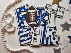 a football themed birthday card with stars and confetti on the table next to it