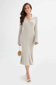 Expertly crafted with a luxurious wool blend and intricate knitted construction, the PARKER dress is a stylish and fitted piece. The ribbed fabric adds texture and the hammered gold buttons add a touch of sophistication. With a flattering fit and flare silhouette, fluted sleeves and collared neckline, this dress is perfect for any occasion. Fabric and Fit: Fine Yarns Blend 58% Viscose, 24% Polyester, 16% Polyamide, 2% Elastane Stretch Factor: Very Stretchy Wearing Length from Shoulder: Approx 12 Fluted Sleeves, Parker Dress, Bridal Jacket, Collared Dress, Hammered Gold, Fine Yarn, Gold Buttons, Collar Dress