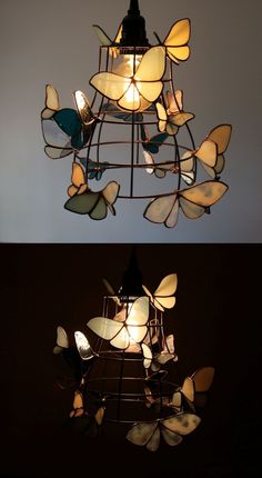 the light fixture is made out of stained glass butterflies