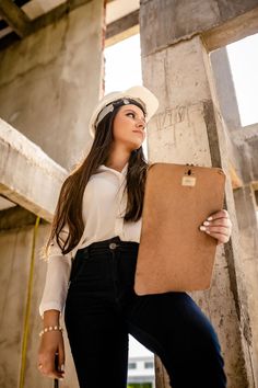 a woman in white hat holding a brown briefcase