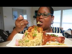 a woman eating food from a white plate