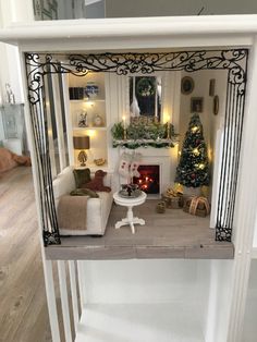 a living room filled with furniture and a fire place in the middle of a room